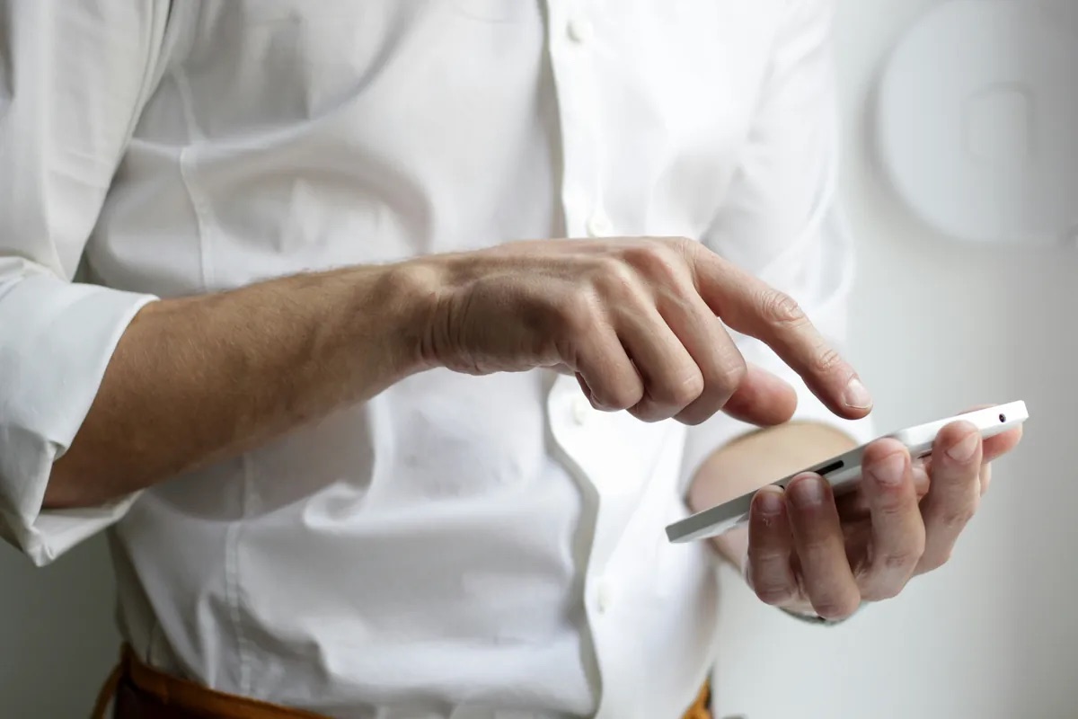 Shareholder receiving a message on a phone